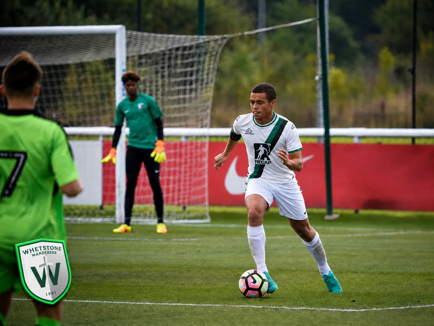 A Whetstone Wanderers player on the ball in a Recap-sponsored shirt